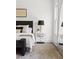 Stylish bedroom with contemporary decor, plush bedding, a side table, and a well-lit window at 1249 Ladd Sw St, Atlanta, GA 30310