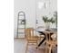 Well-lit dining area with wood floors, a round table, and modern decor elements at 1249 Ladd Sw St, Atlanta, GA 30310