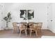Chic dining area featuring modern artwork, wood floors, and an inviting space at 1249 Ladd Sw St, Atlanta, GA 30310