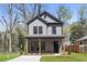 Charming two-story home featuring a gray exterior and a welcoming covered front porch at 1249 Ladd Sw St, Atlanta, GA 30310
