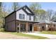 Side view of a modern two-story home with gray siding and a well-maintained lawn at 1249 Ladd Sw St, Atlanta, GA 30310