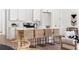 Modern kitchen with white cabinets, stainless steel appliances, and a large island with seating at 1249 Ladd Sw St, Atlanta, GA 30310