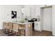 Contemporary kitchen with a large island, white cabinets, and modern stainless steel appliances at 1249 Ladd Sw St, Atlanta, GA 30310