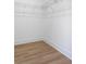 A walk-in closet space with laminate wood flooring and wire shelving, ready for organizing at 1249 Ladd Sw St, Atlanta, GA 30310