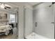 Large bathroom with glass shower and doorway into the primary bedroom at 1260 Ainsworth Aly # 47, Sugar Hill, GA 30518