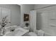 Clean bathroom featuring a shower, vanity, and decorative accents at 1260 Ainsworth Aly # 47, Sugar Hill, GA 30518
