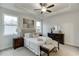 Bright primary bedroom with tray ceilings, neutral decor and an inviting style at 1260 Ainsworth Aly # 47, Sugar Hill, GA 30518