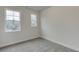 Bedroom featuring carpeted flooring and a double hung window providing lots of natural light at 1260 Ainsworth Aly # 47, Sugar Hill, GA 30518