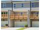 View of the townhome exterior featuring a wooden deck, gray siding and a ground level garage at 1260 Ainsworth Aly # 47, Sugar Hill, GA 30518