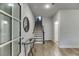 Inviting foyer with hardwood floors, staircase, and access to a bathroom at 1260 Ainsworth Aly # 47, Sugar Hill, GA 30518