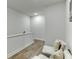 Upstairs hallway seating area features hardwood floors and natural light at 1260 Ainsworth Aly # 47, Sugar Hill, GA 30518