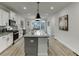 Modern kitchen with white cabinets, granite countertops, and stainless steel appliances at 1260 Ainsworth Aly # 47, Sugar Hill, GA 30518