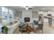 Inviting living room features a fireplace, large windows, comfortable seating, and hardwood floors at 1260 Ainsworth Aly # 47, Sugar Hill, GA 30518