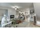Open-concept living room showcasing a fireplace and leading to the kitchen at 1260 Ainsworth Aly # 47, Sugar Hill, GA 30518