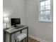Bright office space with natural light from window, desk, lamp and desktop computer at 1260 Ainsworth Aly # 47, Sugar Hill, GA 30518