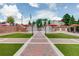 Splash pad featuring multiple water fountains, red umbrellas, and brick paved walkways, perfect for Gathering outings at 1260 Ainsworth Aly # 47, Sugar Hill, GA 30518