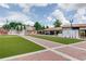 Well-manicured green space with brick walkways and a decorative sign, perfect for community gatherings and events at 1260 Ainsworth Aly # 47, Sugar Hill, GA 30518