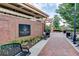 Picturesque brick walkway lined with benches and greenery, offering a peaceful place to relax and enjoy the outdoors at 1260 Ainsworth Aly # 47, Sugar Hill, GA 30518