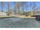 Expansive backyard with mature trees, a wooden fence, and ample space at 1824 Kristen Ct, Suwanee, GA 30024