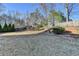 Spacious backyard featuring mature trees and landscape at 1824 Kristen Ct, Suwanee, GA 30024