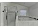 A bathroom featuring a jetted tub and a separate shower at 1824 Kristen Ct, Suwanee, GA 30024