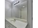 Bathroom with a large vanity, bright lighting, and a shower-tub combo at 1824 Kristen Ct, Suwanee, GA 30024