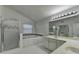 Bathroom featuring double sinks, jetted tub, and separate shower with a tiled floor at 1824 Kristen Ct, Suwanee, GA 30024