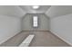 A bedroom with carpet flooring and a window at 1824 Kristen Ct, Suwanee, GA 30024