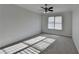 Bedroom featuring a ceiling fan and natural light from a large window at 1824 Kristen Ct, Suwanee, GA 30024