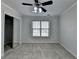 Bedroom featuring a ceiling fan, and natural light coming from a window at 1824 Kristen Ct, Suwanee, GA 30024
