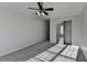 Bedroom with ceiling fan, and view into mirrored closet or secondary bedroom at 1824 Kristen Ct, Suwanee, GA 30024