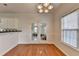 Breakfast nook with access to the backyard, featuring hardwood floors and great natural light at 1824 Kristen Ct, Suwanee, GA 30024
