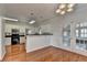 Breakfast nook with breakfast bar, hardwood floors, and access to back at 1824 Kristen Ct, Suwanee, GA 30024