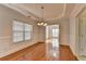 Bright dining room featuring hardwood floors and large window for natural light at 1824 Kristen Ct, Suwanee, GA 30024