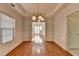 Bright dining area with hardwood floors and natural light from the window at 1824 Kristen Ct, Suwanee, GA 30024