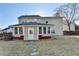Backyard view with sunroom, featuring an exterior of the house at 1824 Kristen Ct, Suwanee, GA 30024