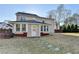 Exterior view of the home, showcasing the sunroom addition and backyard at 1824 Kristen Ct, Suwanee, GA 30024