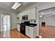Bright kitchen corner view with stainless steel appliances and an open view to the living room at 1824 Kristen Ct, Suwanee, GA 30024