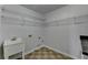 Functional laundry room with utility sink and ample wire shelving at 1824 Kristen Ct, Suwanee, GA 30024