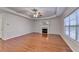 Spacious living room featuring a decorative ceiling, hardwood floors, and a fireplace at 1824 Kristen Ct, Suwanee, GA 30024