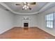 Bright living room with decorative ceiling, hardwood floors, and fireplace at 1824 Kristen Ct, Suwanee, GA 30024