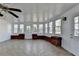 Inviting sunroom featuring tile flooring and multiple windows for bright daylight at 1824 Kristen Ct, Suwanee, GA 30024