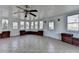 Bright sunroom with tile flooring, brick accents, and lots of natural light at 1824 Kristen Ct, Suwanee, GA 30024