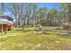 Spacious backyard with large grassy area and picnic table, perfect for outdoor activities at 4444 Casco Nw Ln, Lilburn, GA 30047