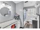 Functional bathroom with a white vanity, updated countertop, and a shower/tub combo at 4444 Casco Nw Ln, Lilburn, GA 30047
