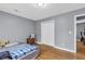 Light-filled bedroom offers hardwood floors and a closet, creating a simple retreat at 4444 Casco Nw Ln, Lilburn, GA 30047