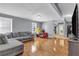Open-concept living room features hardwood floors, light gray walls, and plenty of natural light at 4444 Casco Nw Ln, Lilburn, GA 30047