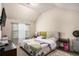 Bright bedroom with large window, patterned bedding, and a tufted headboard offering a relaxing space at 5761 Sawgrass Cir, Lithonia, GA 30038