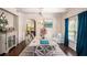 Formal dining room featuring a large table, stylish decor, and an archway to another room at 5761 Sawgrass Cir, Lithonia, GA 30038