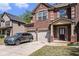 Traditional brick house with a two car garage and professionally landscaped front yard at 5761 Sawgrass Cir, Lithonia, GA 30038